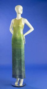 long sequin evening gown shading from yellow at shoulders to green at hips and blue at hem